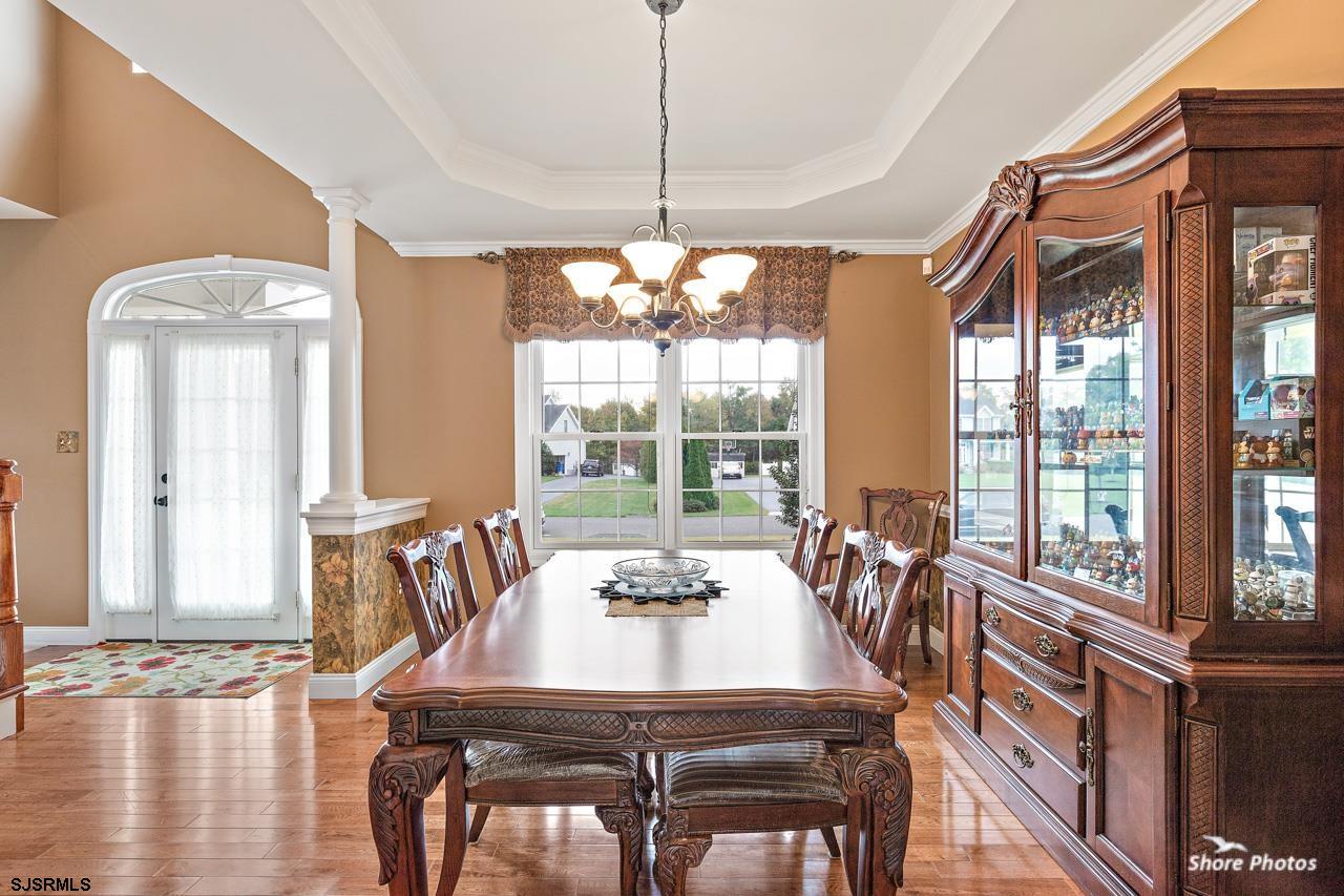 49 Killdeer Hill Road Woodbine, NJ 08270 - Photo 10 of 56 a dining room with furniture a chandelier and wooden floor