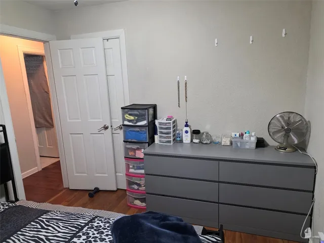 a room with a baby crib and a dresser