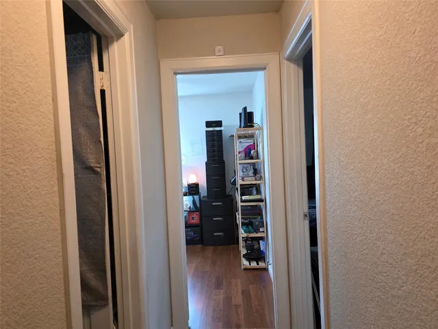 a view of a bedroom from a hallway