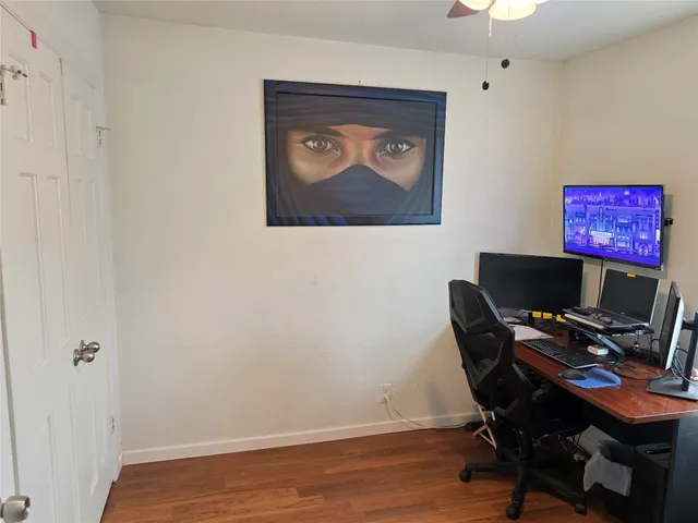 a workspace with furniture and wooden floor