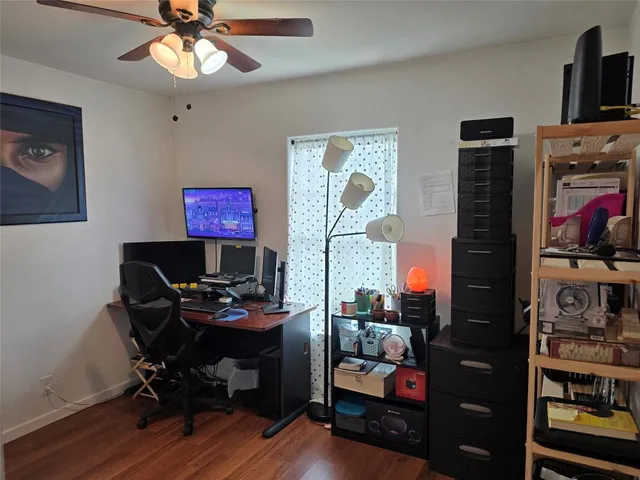a workspace with furniture and wooden floor