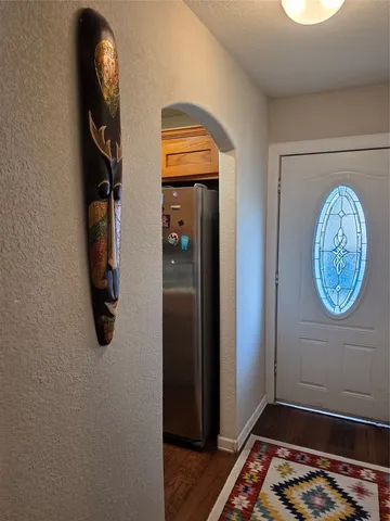 a view of entryway with wooden floor