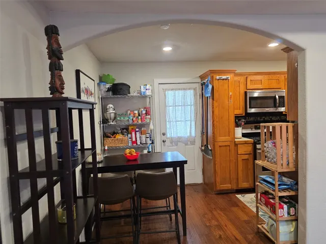 a view of a dining room with furniture and wooden floor