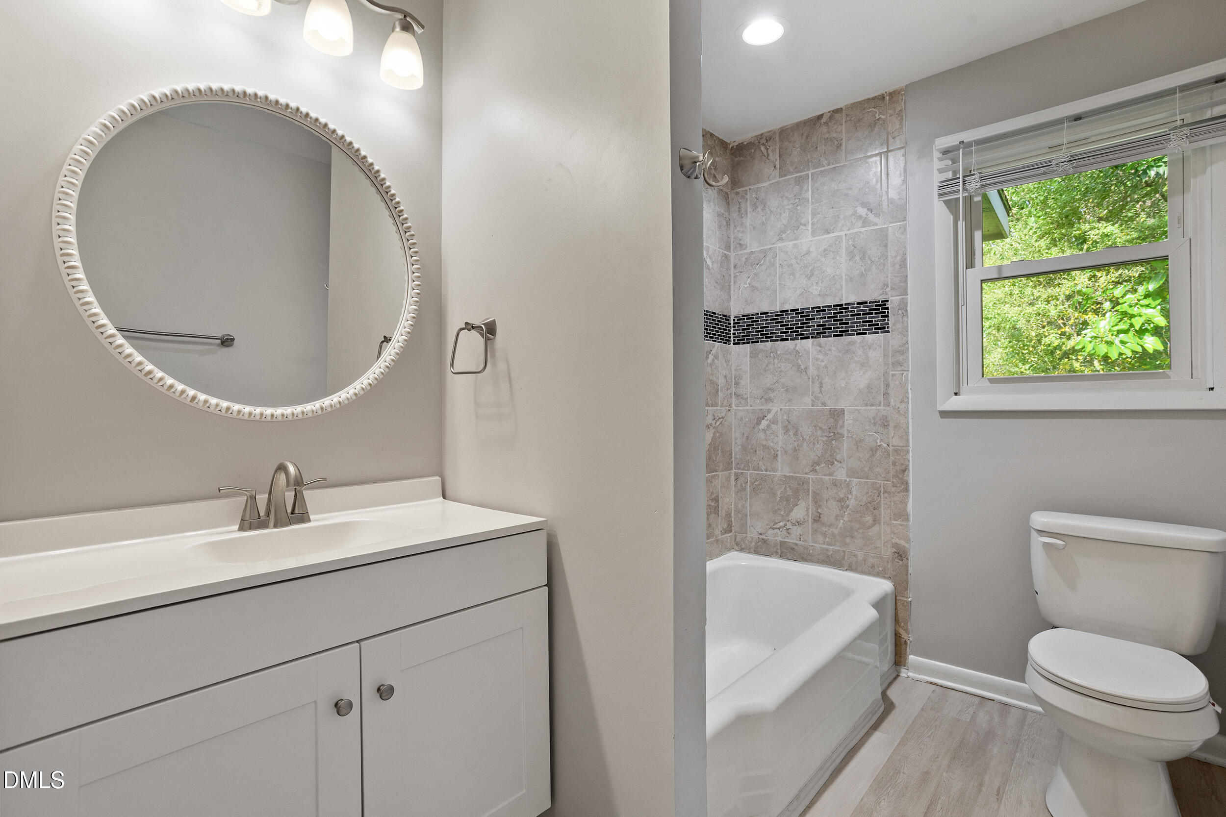 2414 Chapin Street Durham, NC 27707 - Photo 25 of 30 a bathroom with a sink toilet and shower
