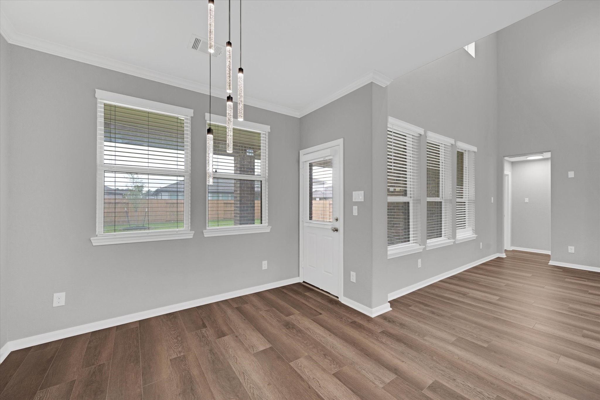 3834 Supremes Trail Spring, TX 77386 - Photo 18 of 36 a view of an empty room with wooden floor and a window