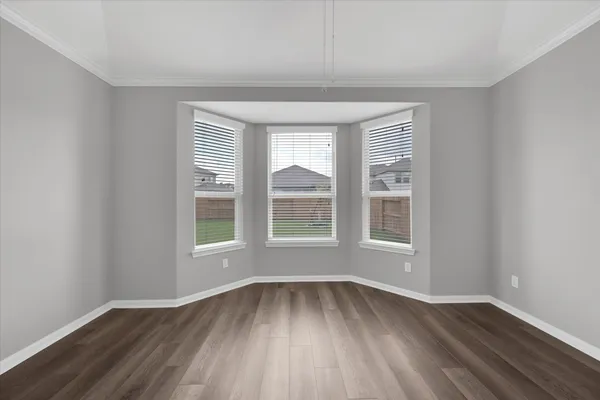 a bathroom with a granite countertop sink a toilet and bathtub
