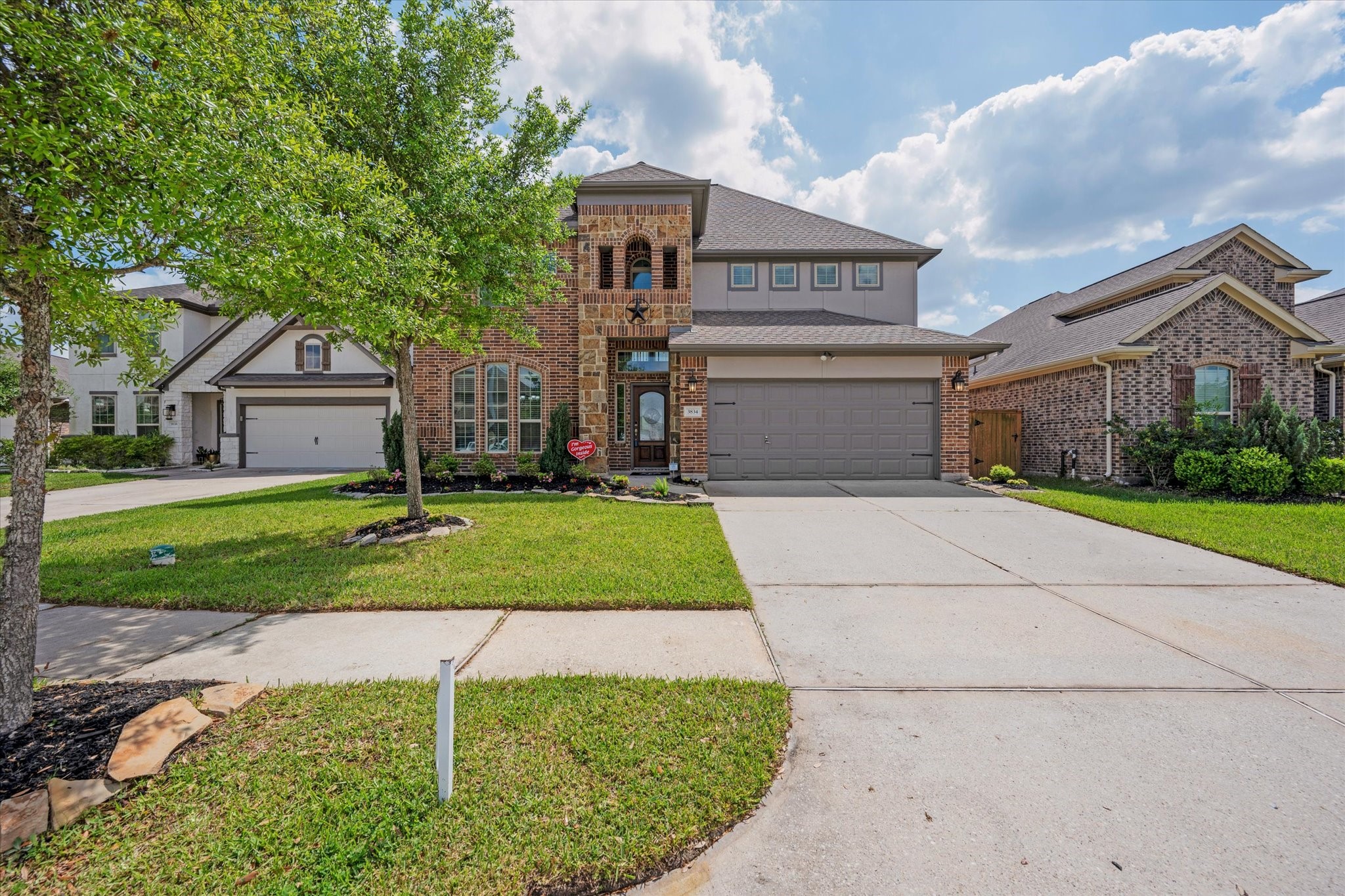 3834 Supremes Trail Spring, TX 77386 - Photo 2 of 36 a front view of a house with a yard and garage