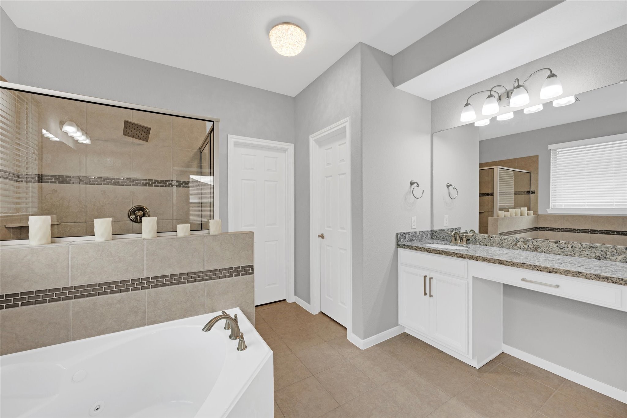 3834 Supremes Trail Spring, TX 77386 - Photo 23 of 36 a bathroom with a tub sink and mirror