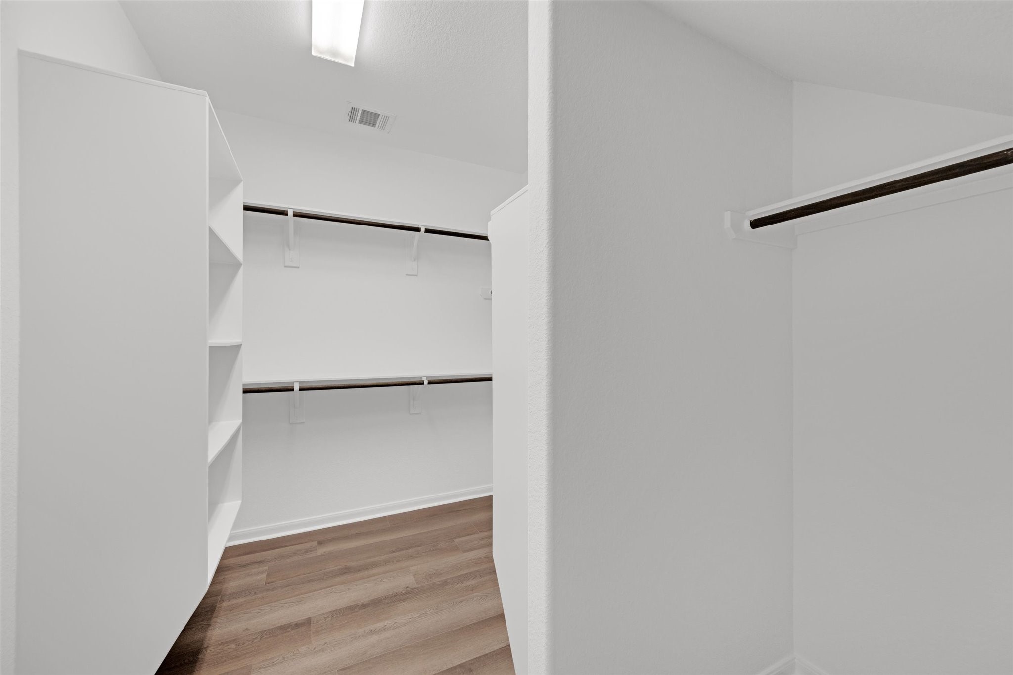 3834 Supremes Trail Spring, TX 77386 - Photo 25 of 36 a view of walk in closet with empty racks