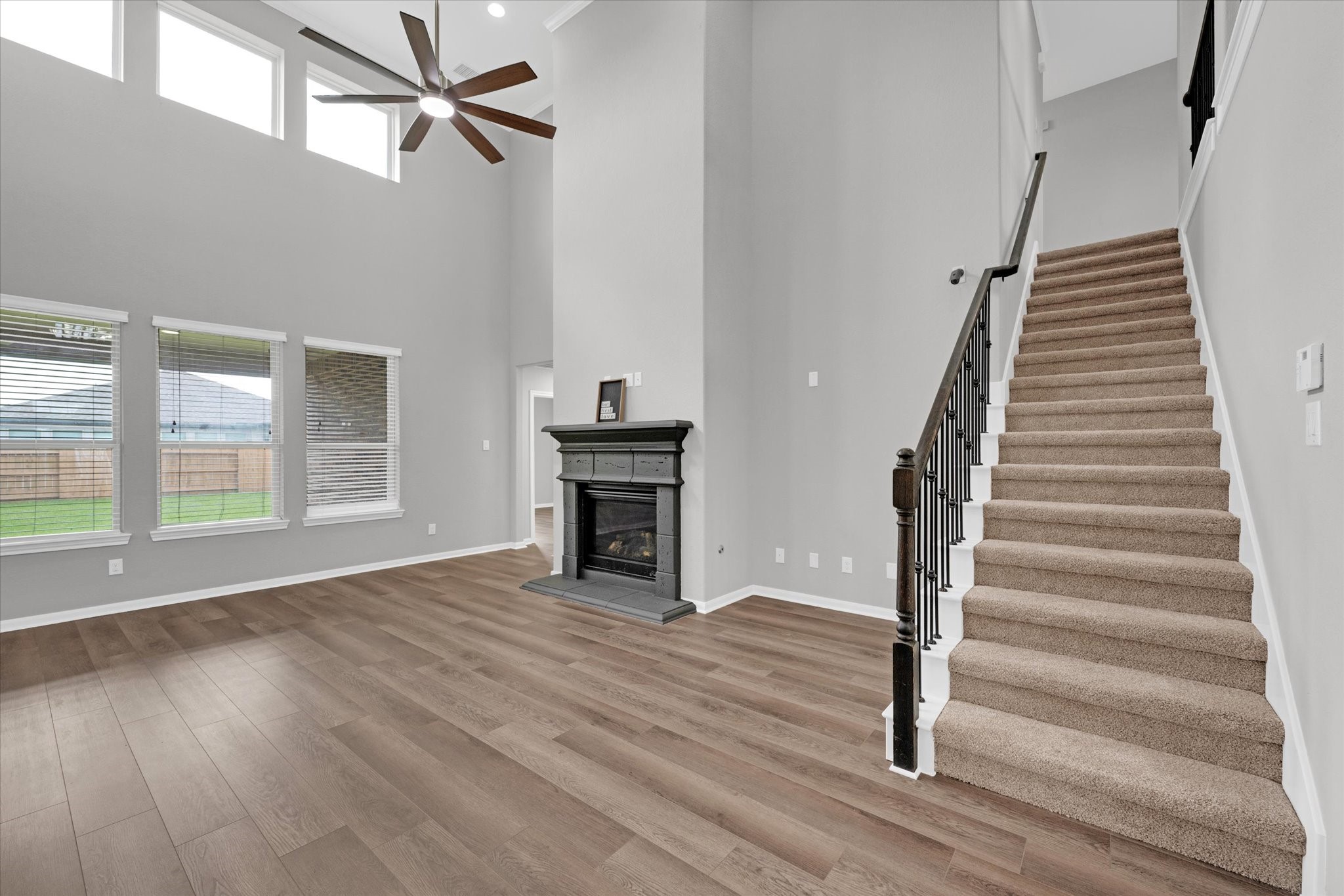 3834 Supremes Trail Spring, TX 77386 - Photo 26 of 36 a view of an empty room with wooden floor fireplace and a window