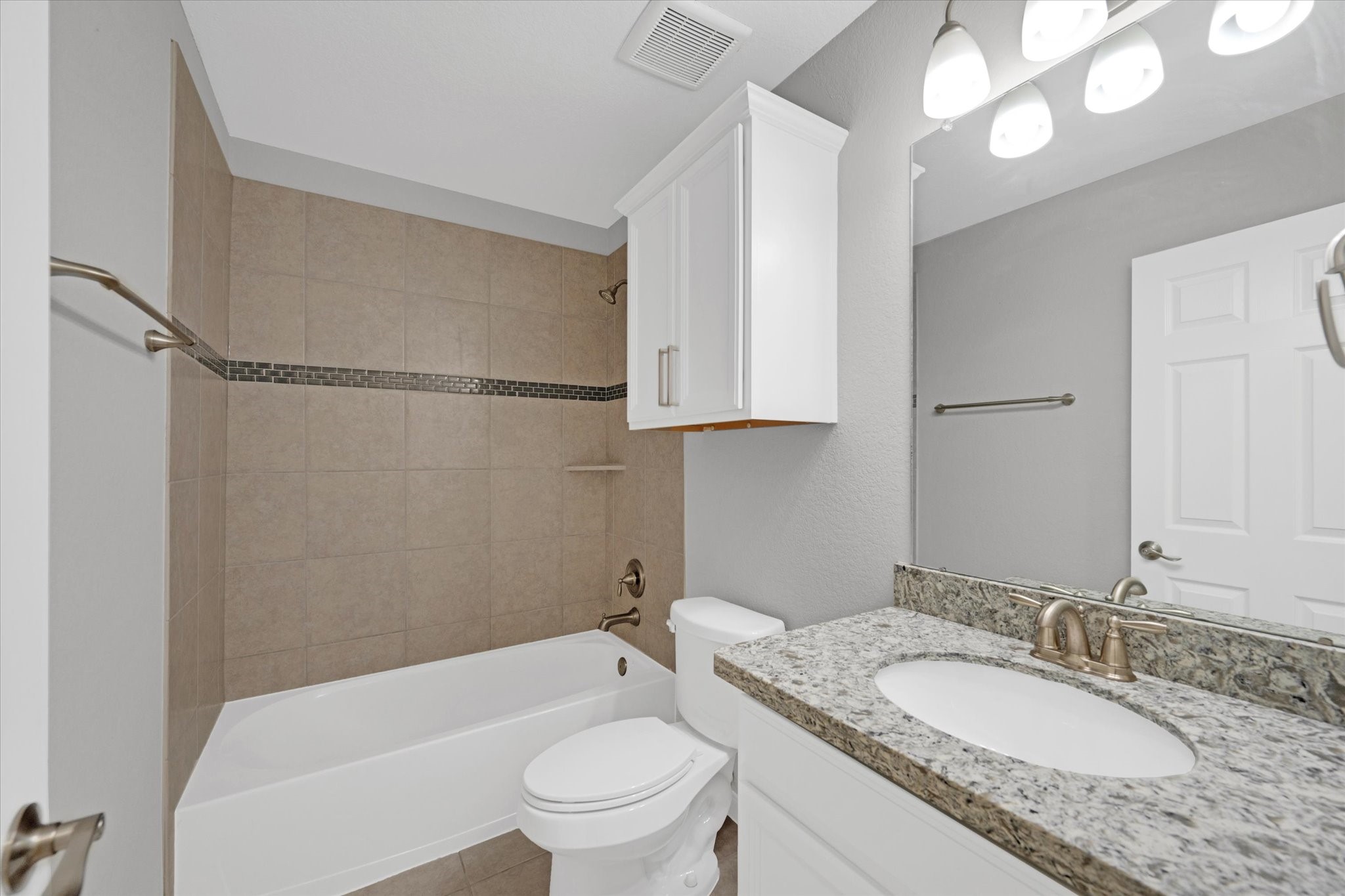 3834 Supremes Trail Spring, TX 77386 - Photo 28 of 36 a bathroom with a granite countertop sink a toilet and bathtub