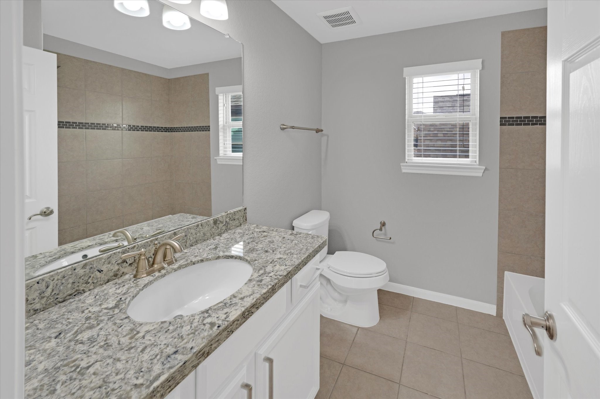 3834 Supremes Trail Spring, TX 77386 - Photo 31 of 36 a bathroom with a granite countertop sink toilet and shower