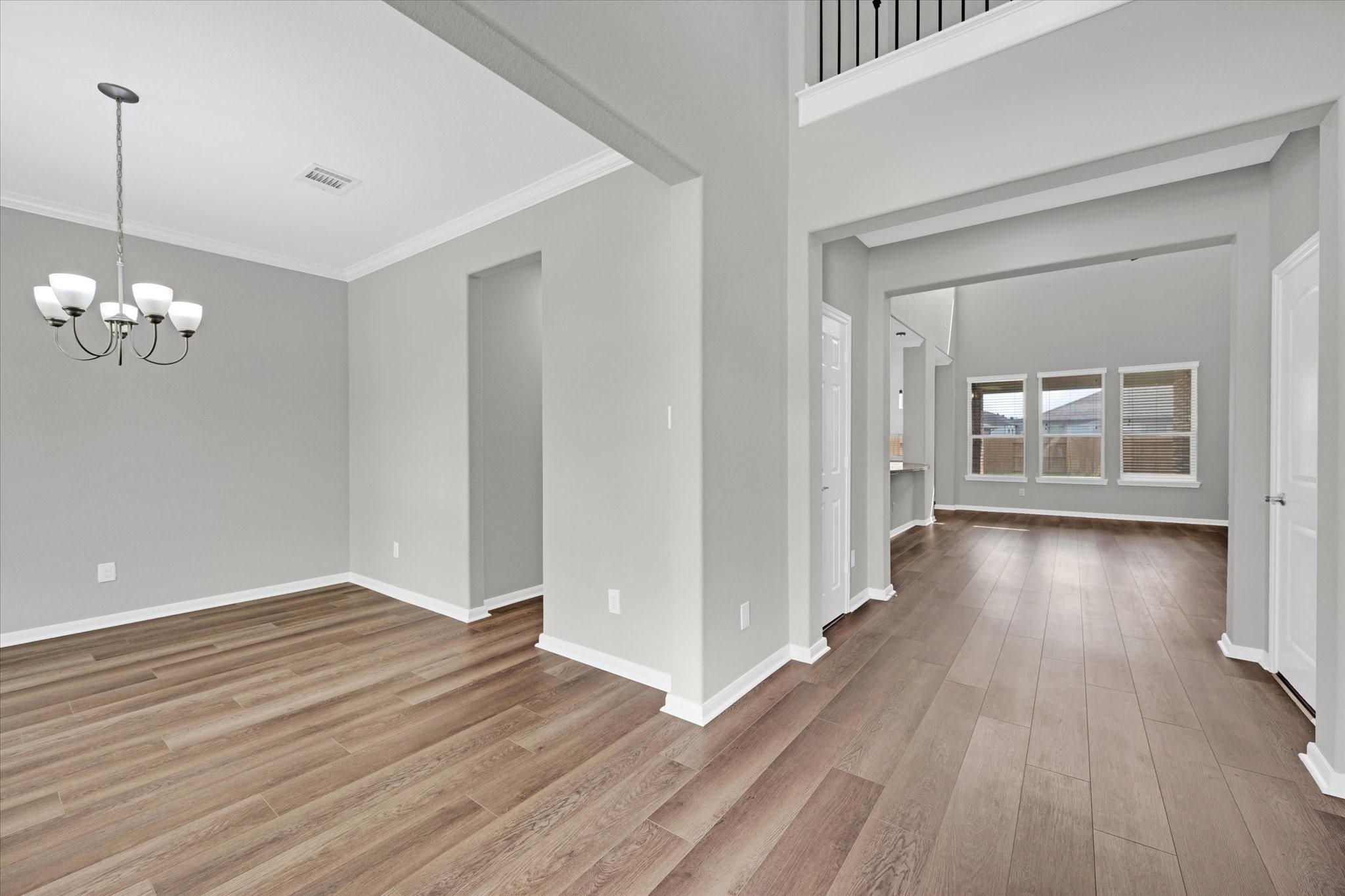 3834 Supremes Trail Spring, TX 77386 - Photo 7 of 36 a view of an empty room with wooden floor and a window
