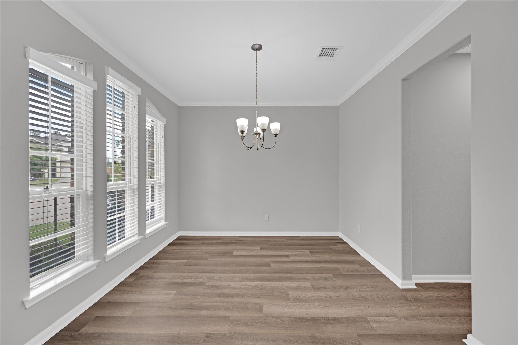 3834 Supremes Trail Spring, TX 77386 - Photo 8 of 36 a view of an empty room with wooden floor and a window