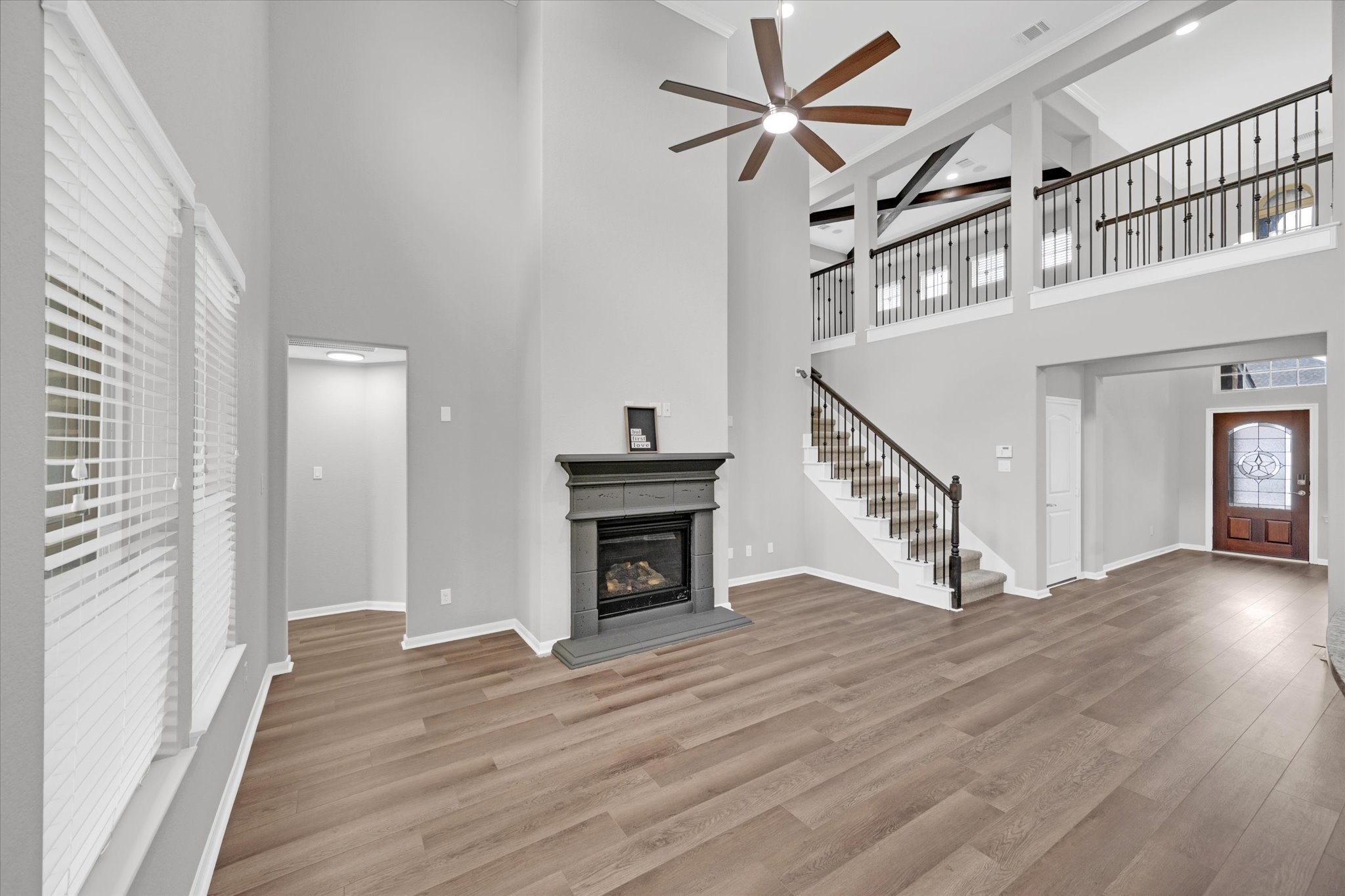 3834 Supremes Trail Spring, TX 77386 - Photo 10 of 36 a view of an entryway with wooden floor fireplace and a window