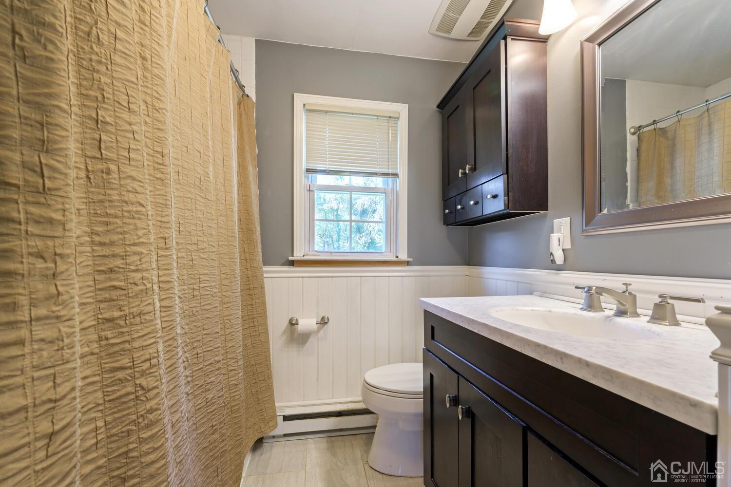 13 Fresh Ponds Road Monroe Township, NJ 08831 - Photo 16 of 20 Main bathroom, with updated Wainscoting and Subway Tile Decor.