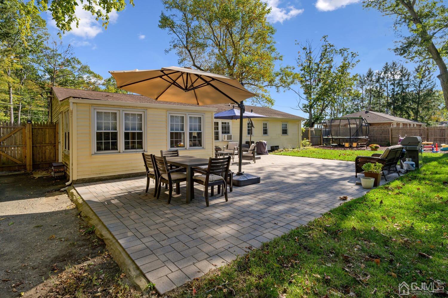 13 Fresh Ponds Road Monroe Township, NJ 08831 - Photo 18 of 20 A beautiful patio with lots of space for entertaining your guests. There's a play area to the right with rubber mulch for the little ones to play on.