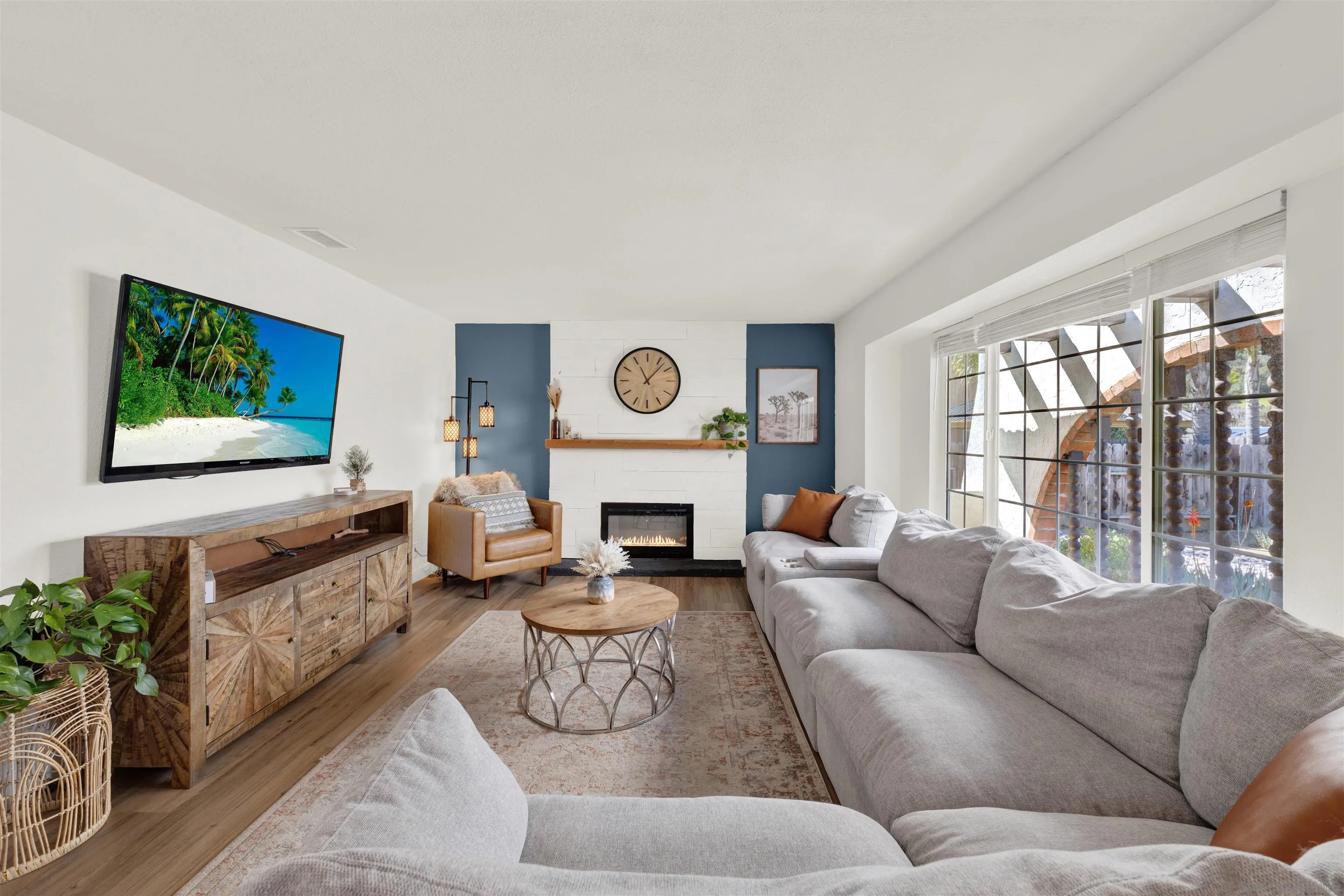 12435 Old Pomerado Road Poway, CA 92064 - Photo 12 of 53 a living room with furniture a fireplace and a flat screen tv