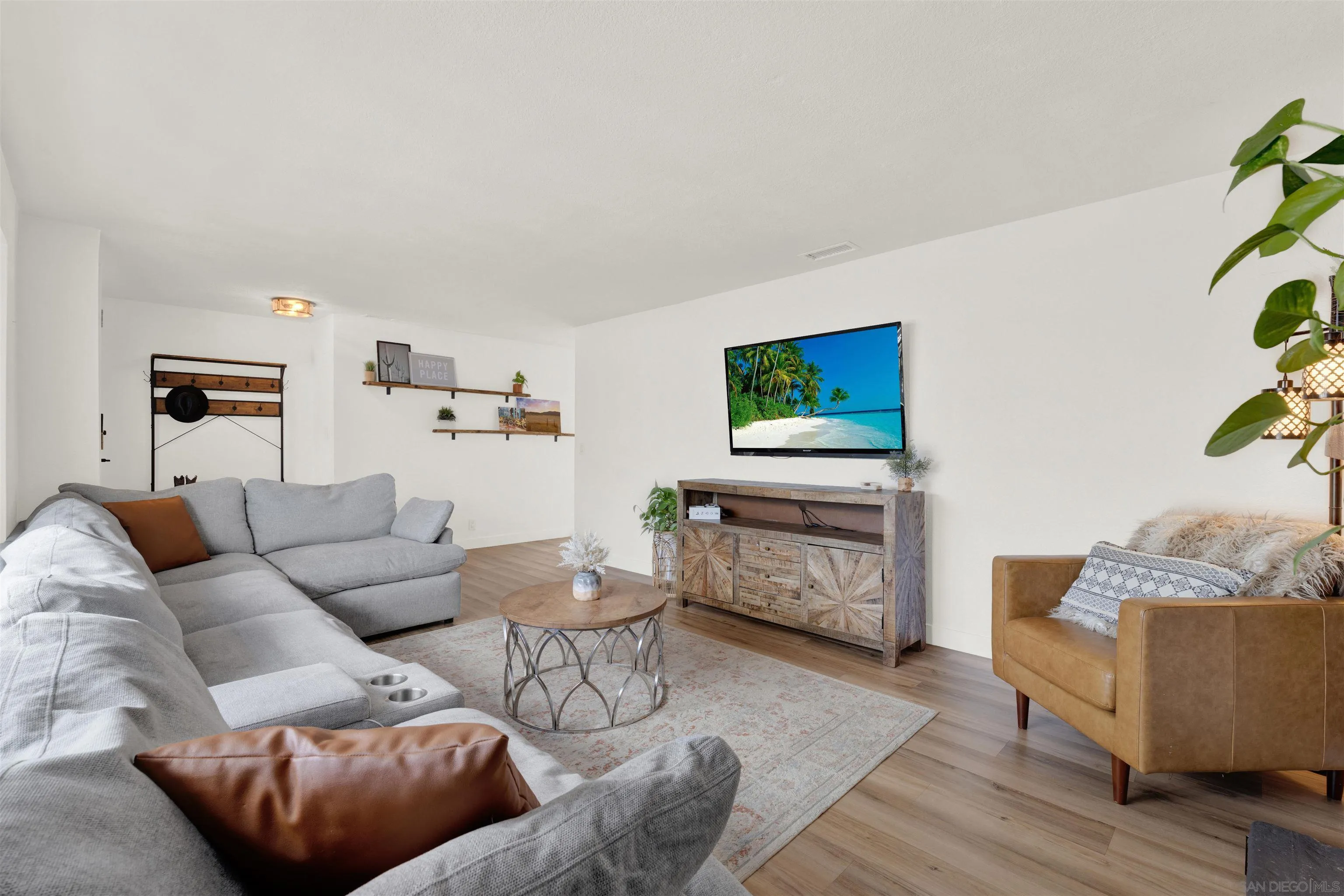 12435 Old Pomerado Road Poway, CA 92064 - Photo 13 of 53 a living room with furniture and a flat screen tv