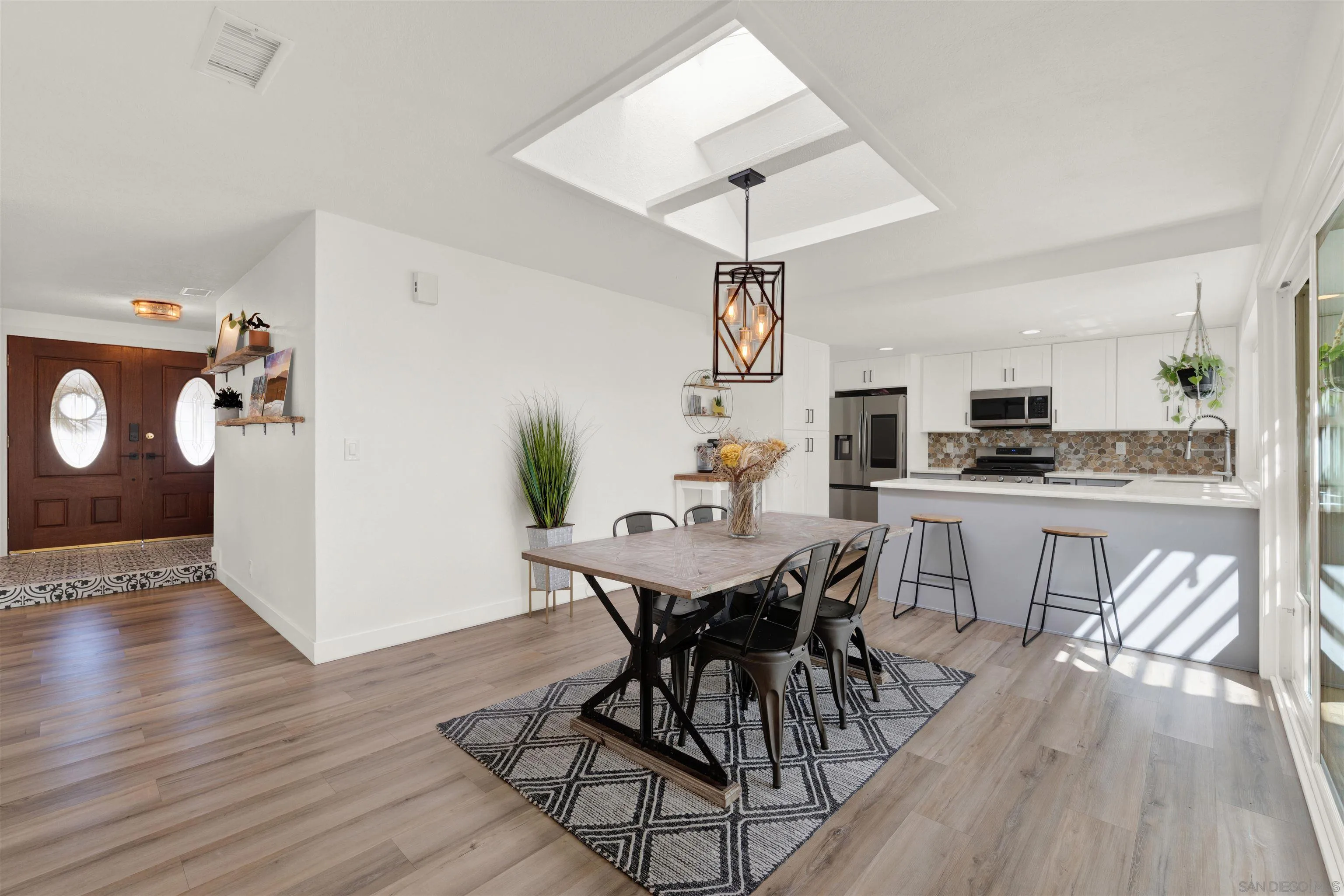 12435 Old Pomerado Road Poway, CA 92064 - Photo 15 of 53 a view of a dining room with furniture and wooden floor
