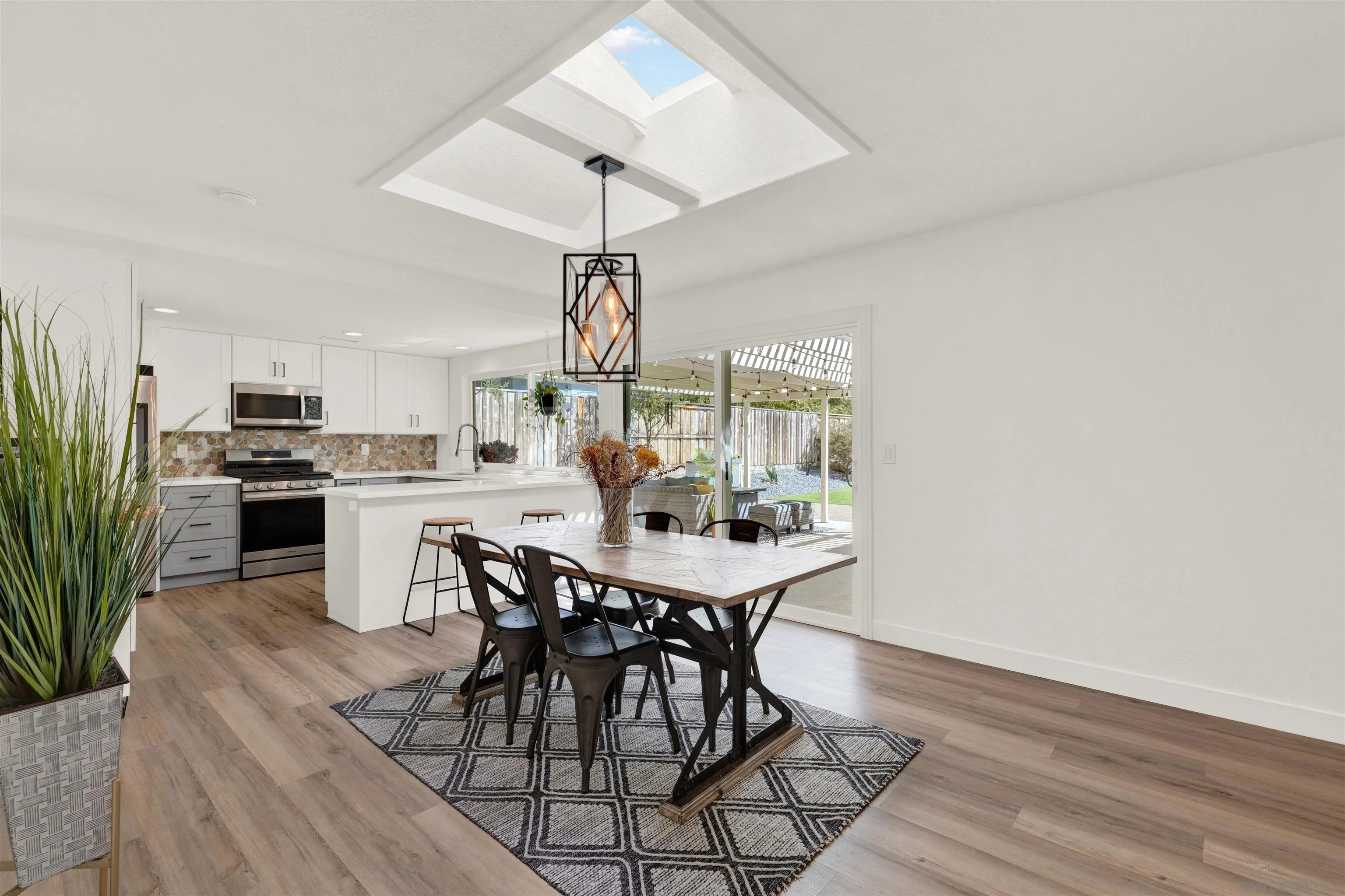 12435 Old Pomerado Road Poway, CA 92064 - Photo 16 of 53 a view of a dining room with furniture and wooden floor
