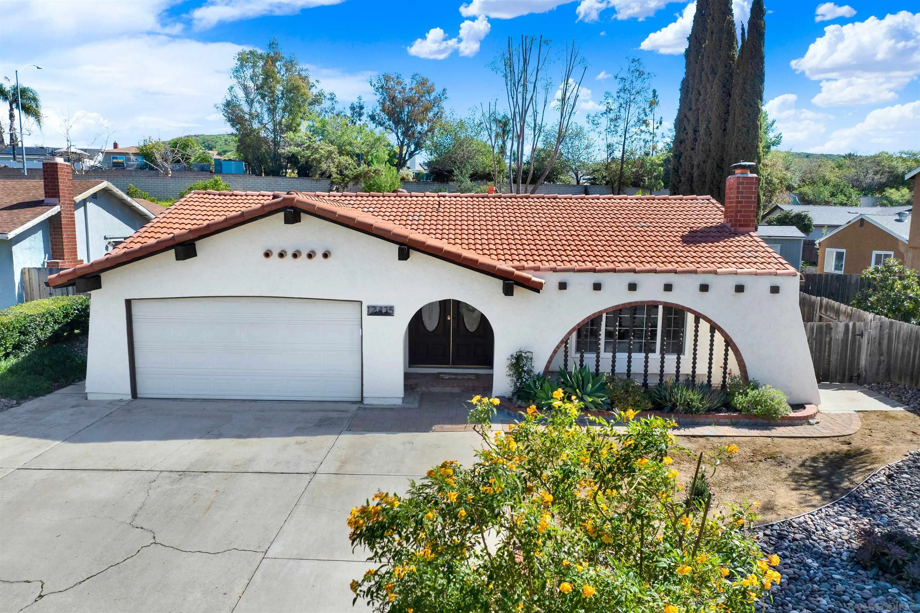 12435 Old Pomerado Road Poway, CA 92064 - Photo 2 of 53 a front view of a house with a yard and garage