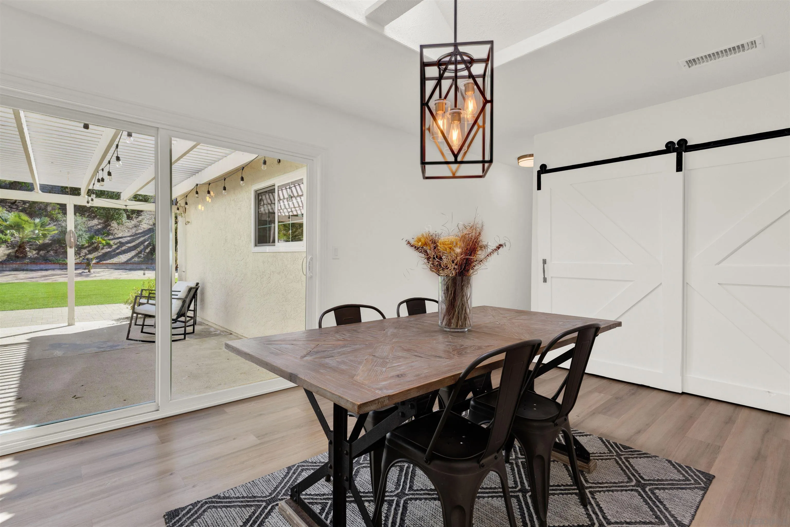 12435 Old Pomerado Road Poway, CA 92064 - Photo 22 of 53 a view of a dining room with furniture and wooden floor