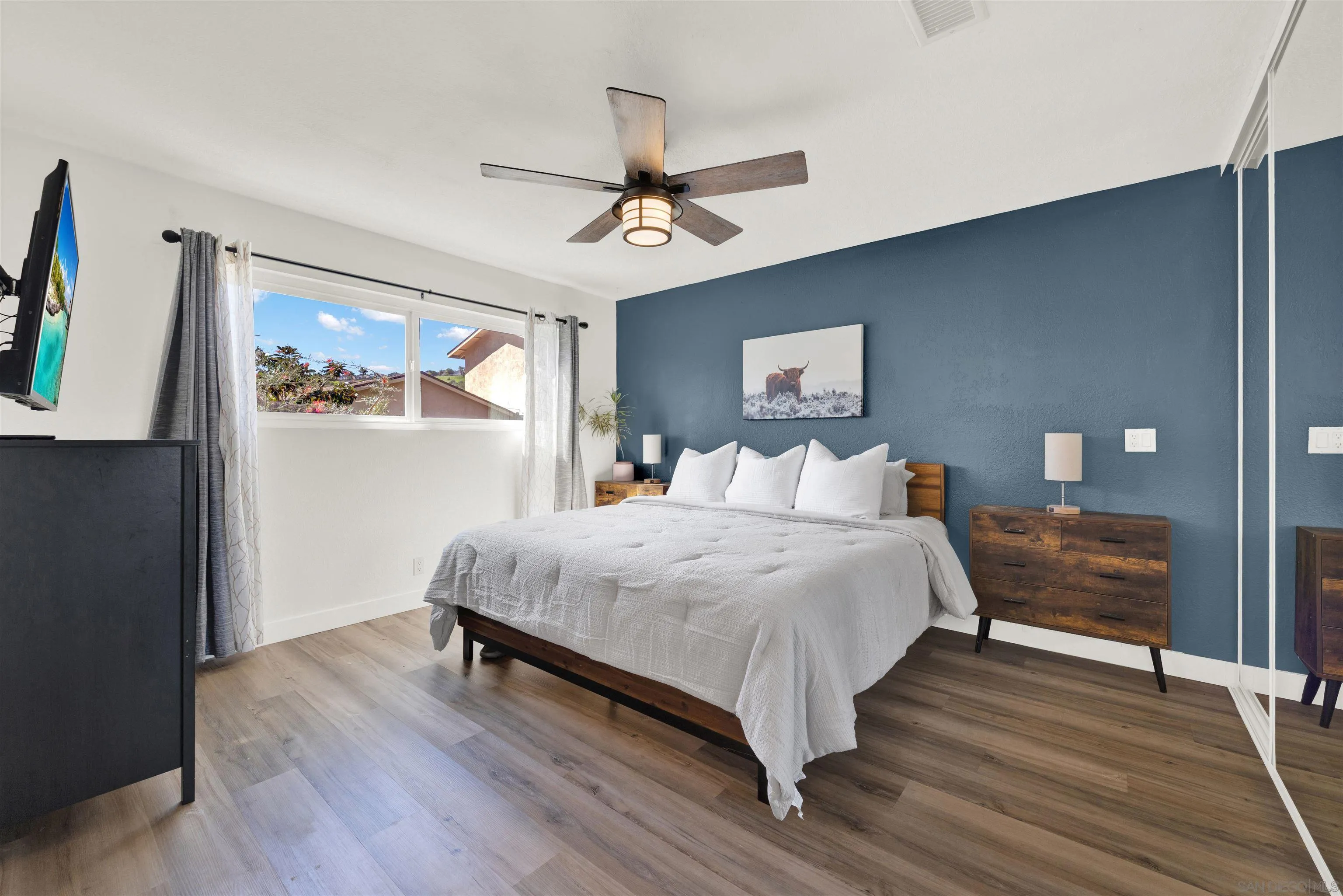 12435 Old Pomerado Road Poway, CA 92064 - Photo 30 of 53 a bedroom with a bed and wooden floor