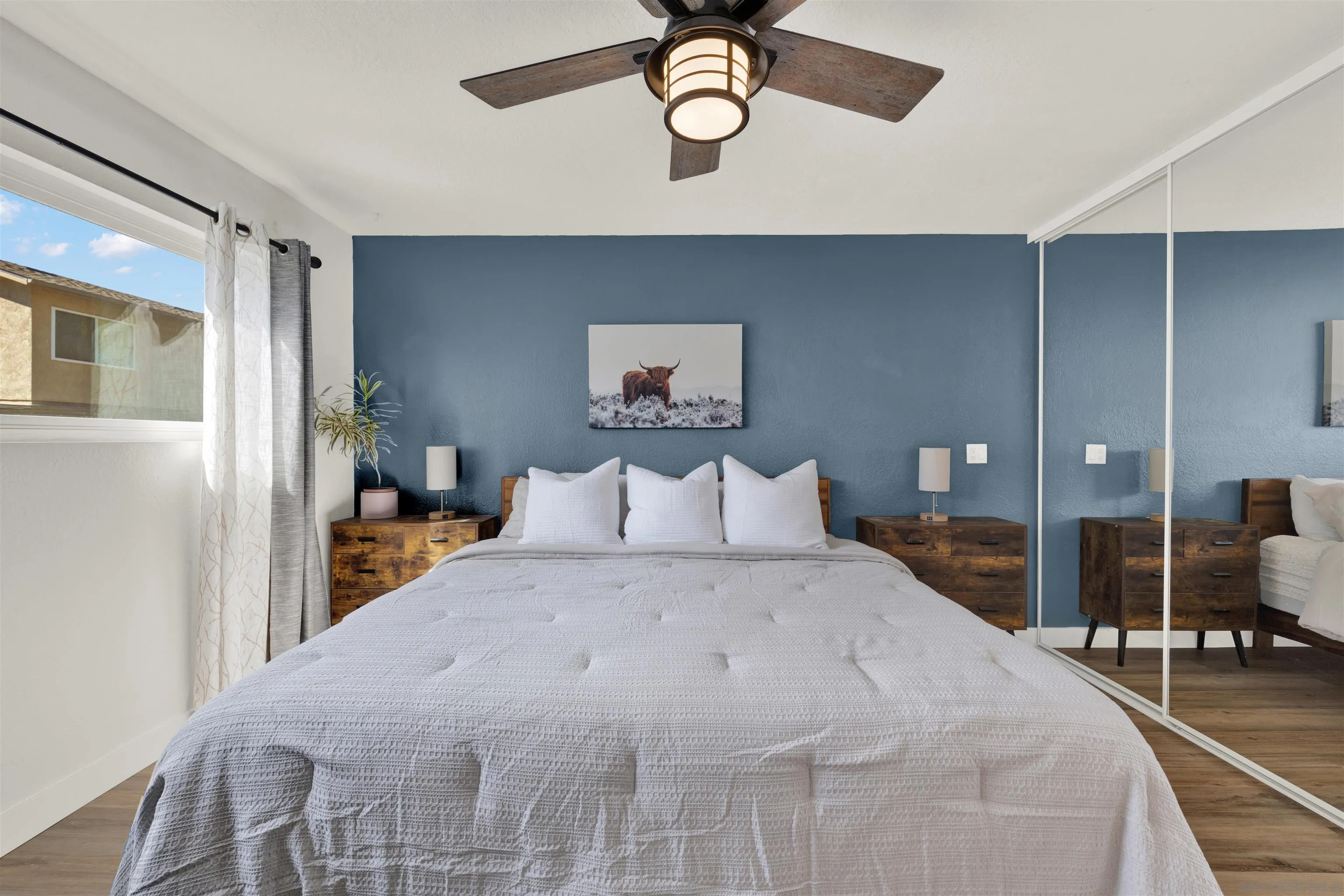 12435 Old Pomerado Road Poway, CA 92064 - Photo 31 of 53 a bedroom with a bed and a chandelier