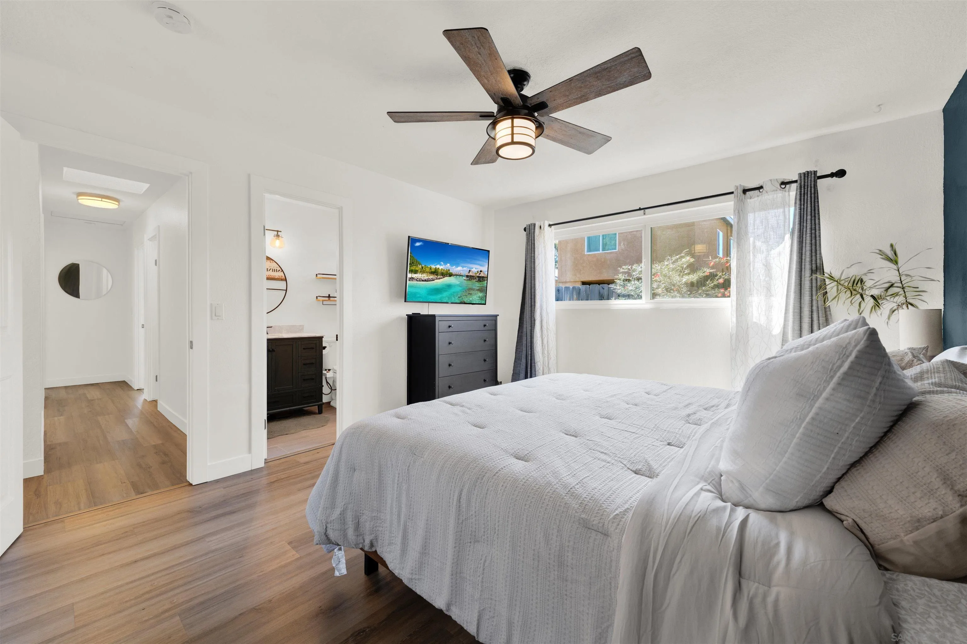 12435 Old Pomerado Road Poway, CA 92064 - Photo 32 of 53 a bedroom with a bed and wooden floor