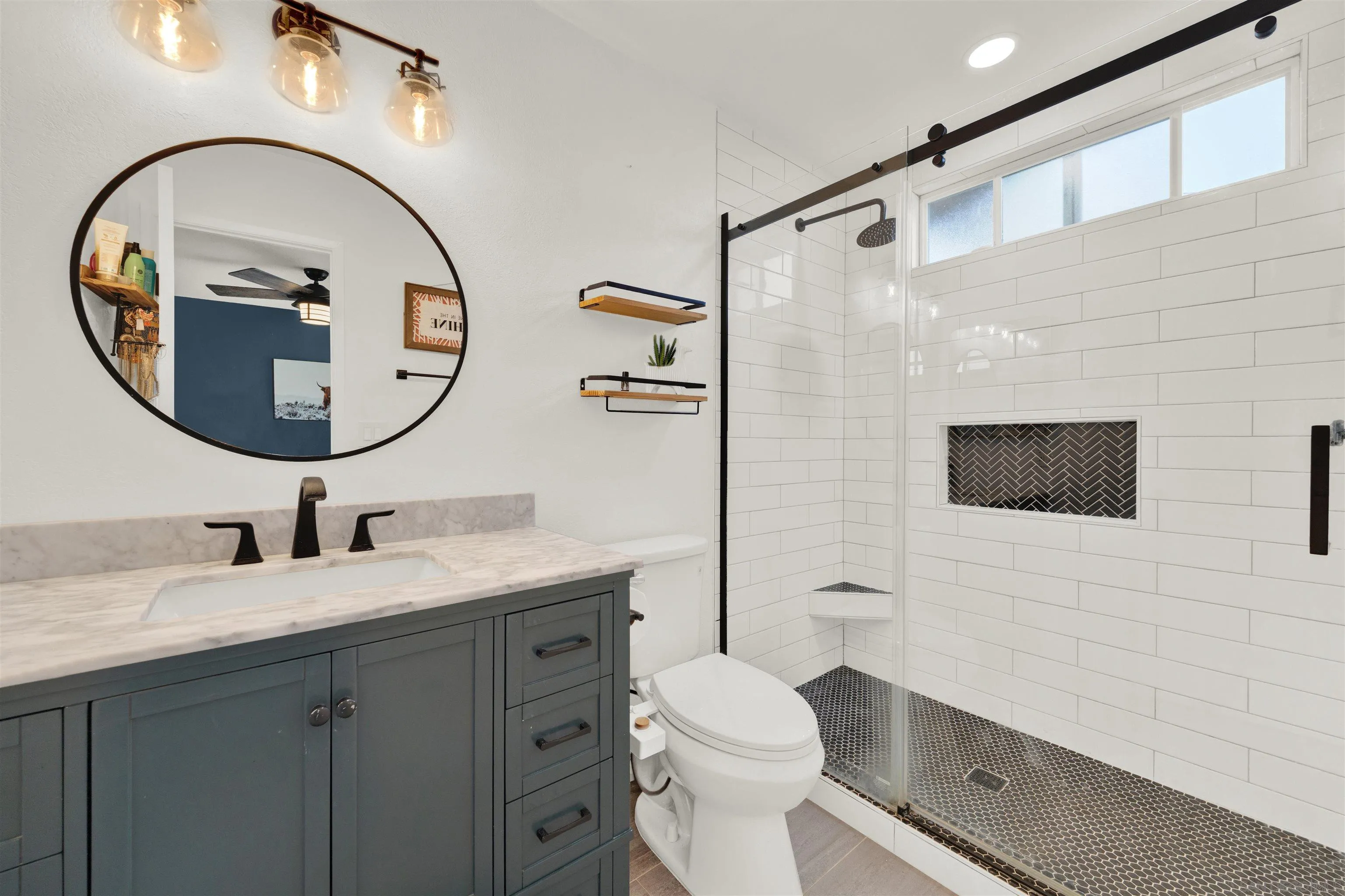 12435 Old Pomerado Road Poway, CA 92064 - Photo 33 of 53 a bathroom with a toilet a sink and a mirror