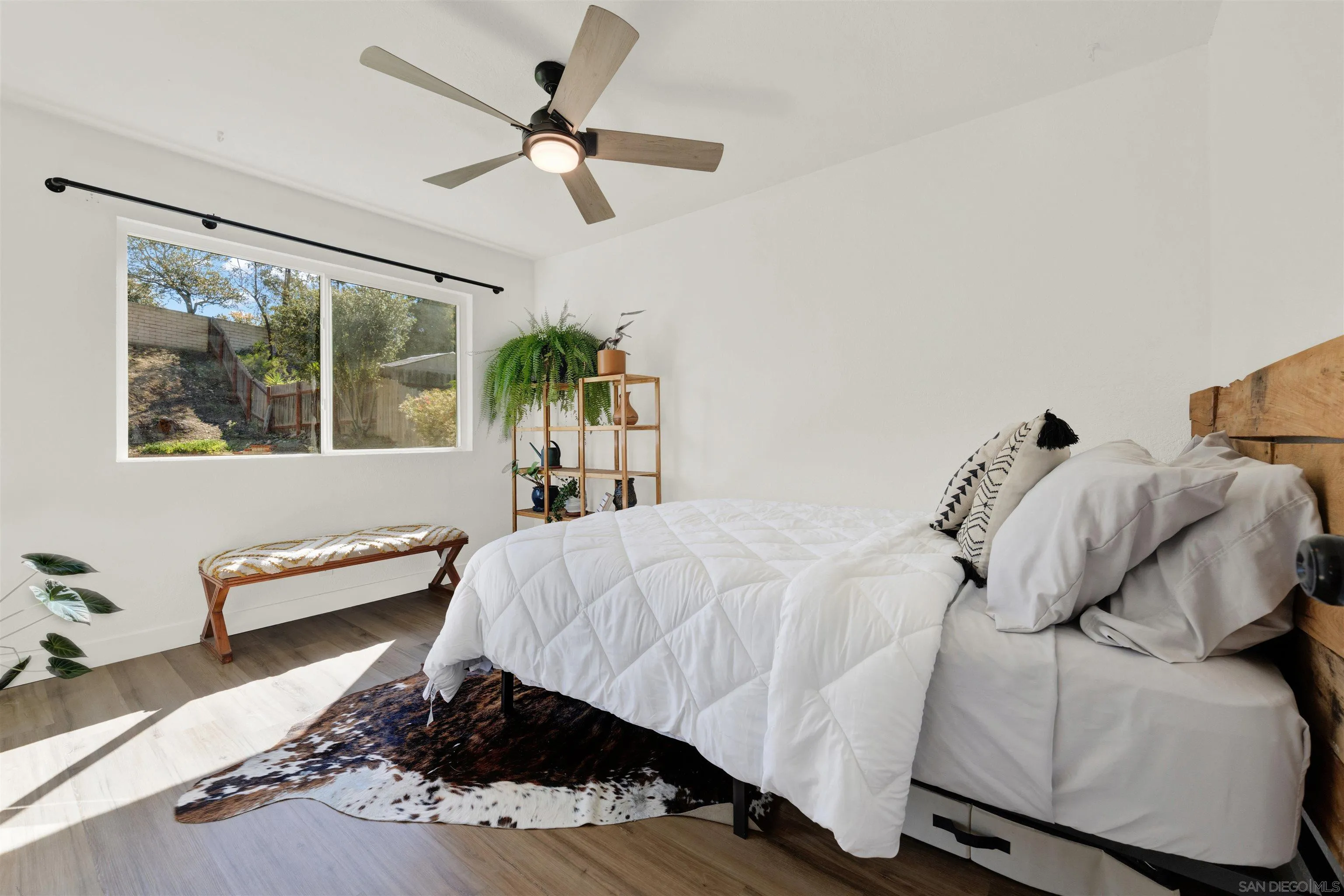 12435 Old Pomerado Road Poway, CA 92064 - Photo 36 of 53 a bed sitting in a bedroom next to a window