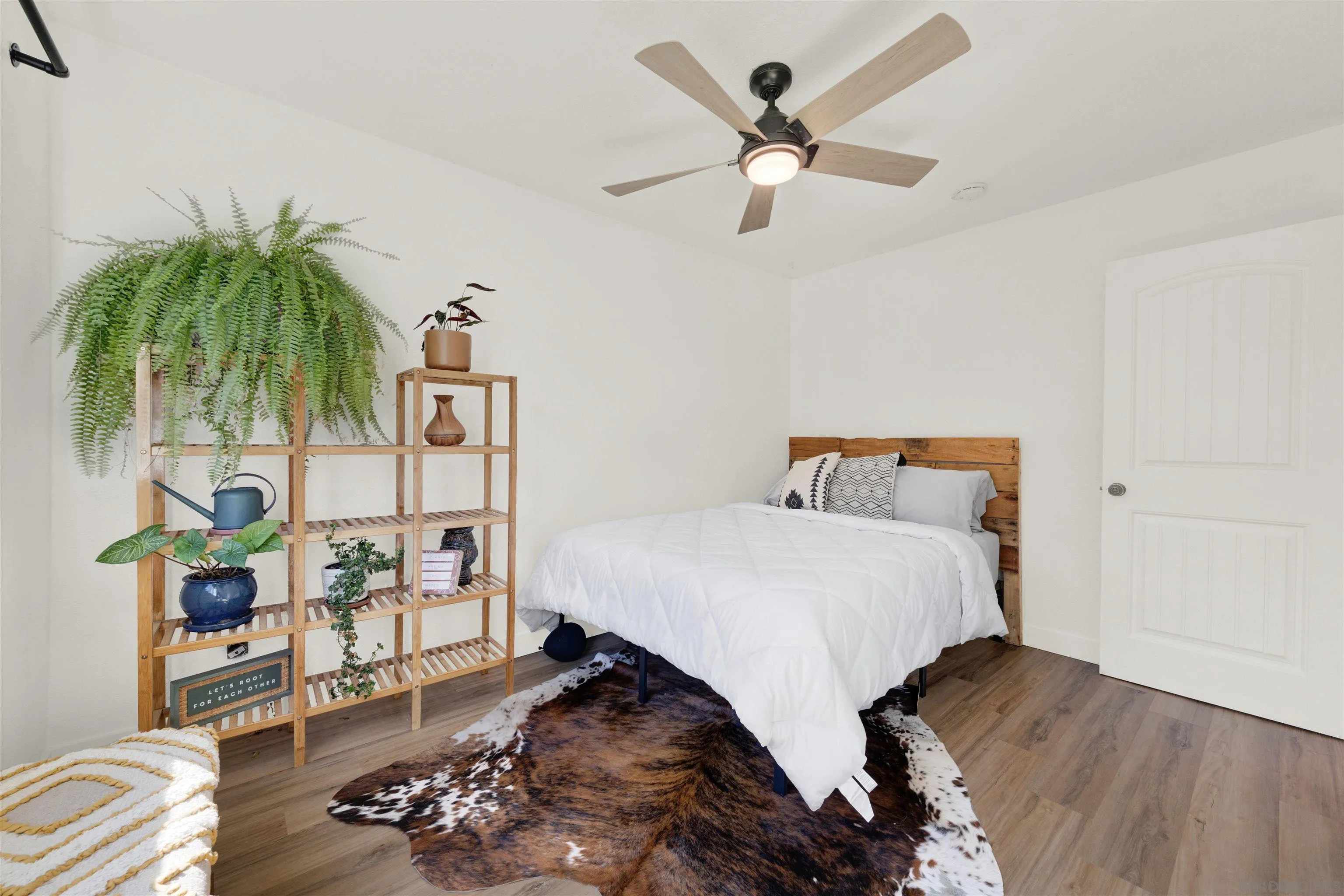 12435 Old Pomerado Road Poway, CA 92064 - Photo 38 of 53 a bedroom with a bed and a chandelier