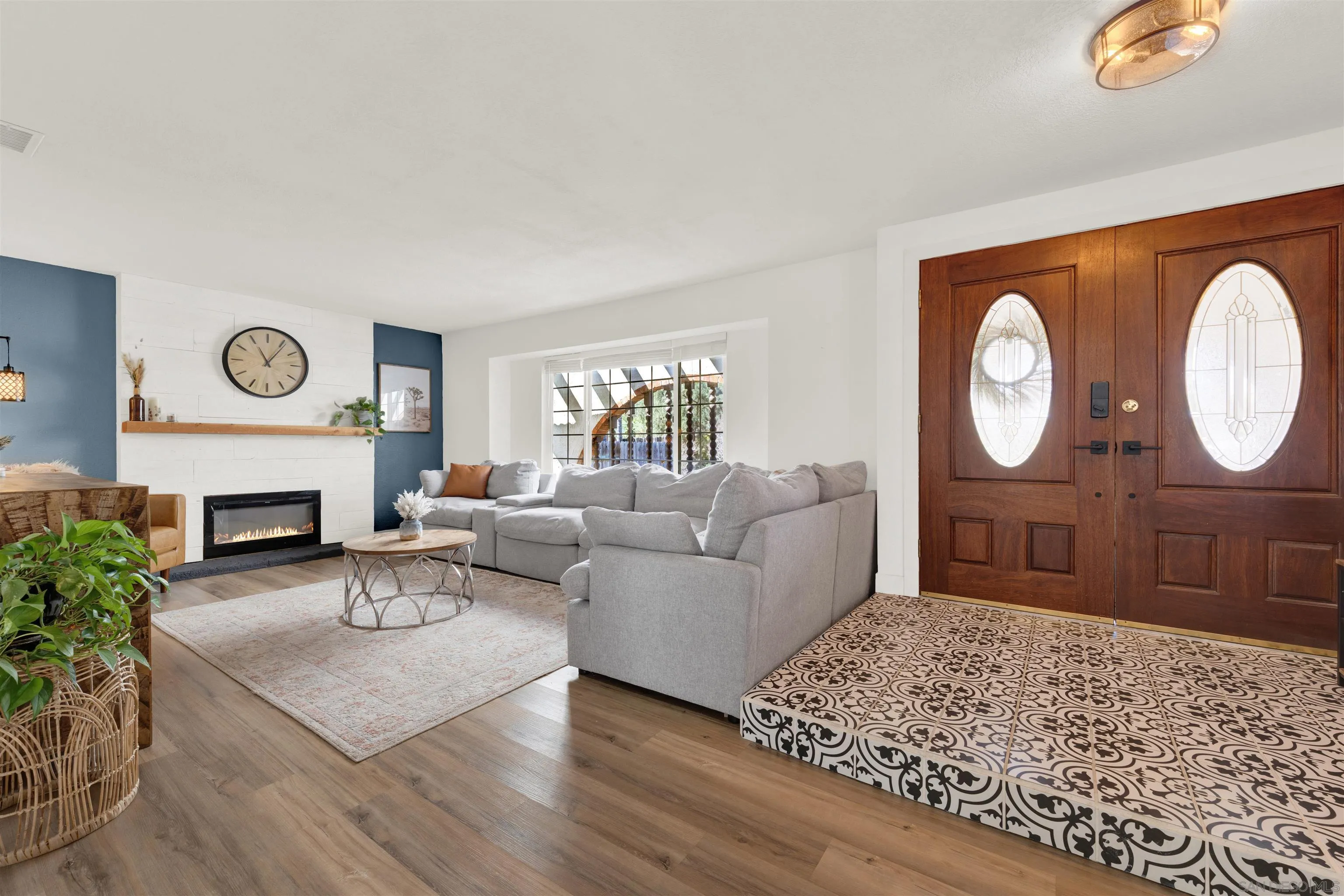 12435 Old Pomerado Road Poway, CA 92064 - Photo 10 of 53 a living room with furniture a clock and a fireplace