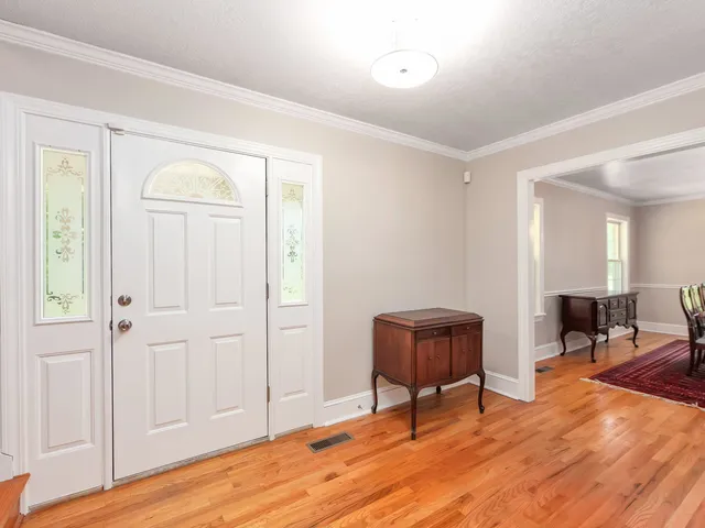 a view of a livingroom with furniture and wooden floor