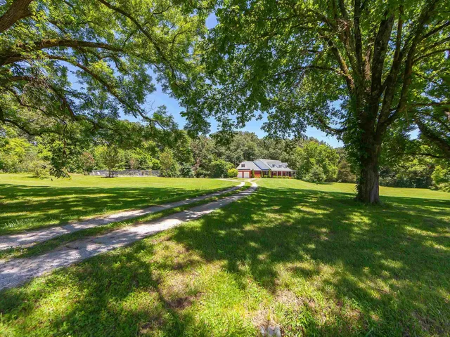 a view of a golf course with a trees