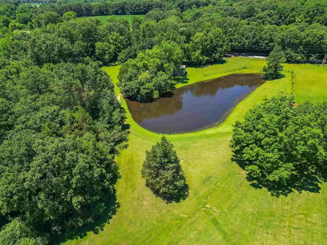 an aerial view of a house with a garden