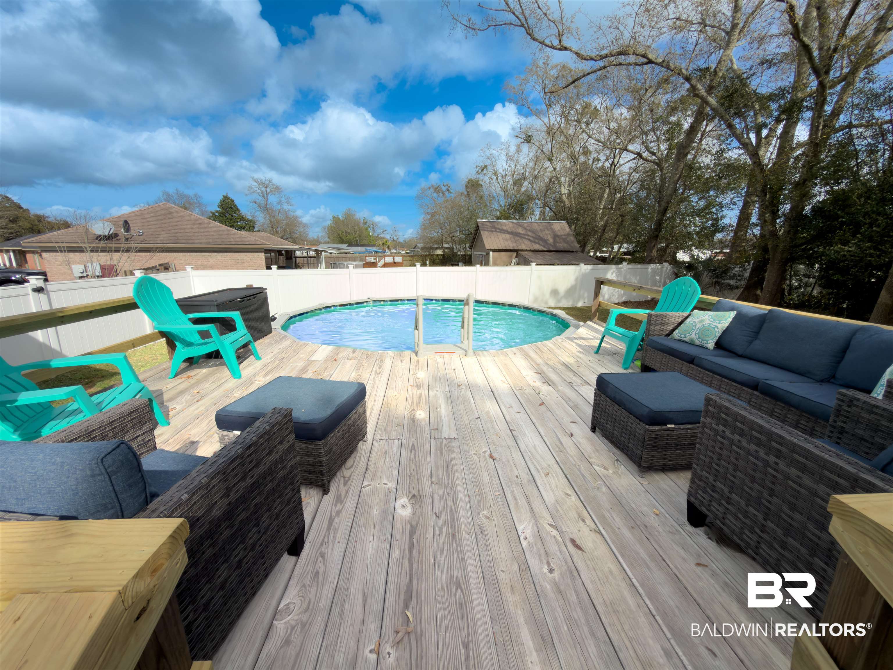 129 Pennbrooke Loop Foley, AL 36535 - Photo 37 of 44 View of pool with outdoor seating, a deck, and a fenced backyard