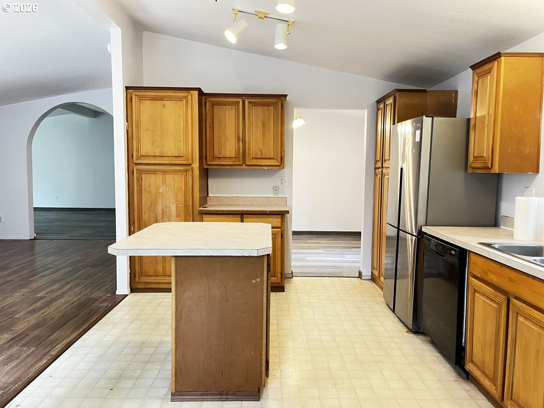 83411 Clear Lake Road Florence, OR 97439 - Photo 14 of 47 a kitchen with stainless steel appliances wooden floor and a refrigerator
