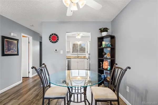 a view of a dining room with furniture and wooden floor