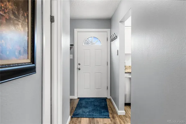 a view of a hallway with front door