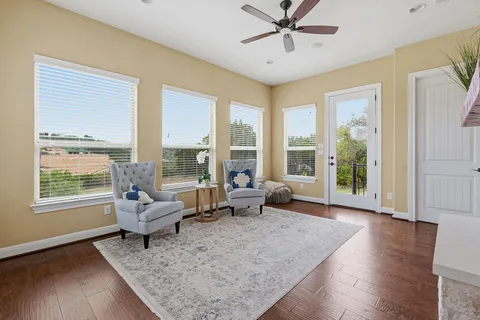 a view of a dining room with furniture window and wooden floor