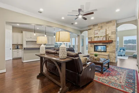 a living room with furniture and a fireplace