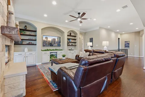 a kitchen with granite countertop a sink and white cabinets