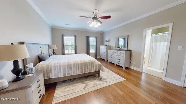 a spacious bedroom with a bed and a walk in closet