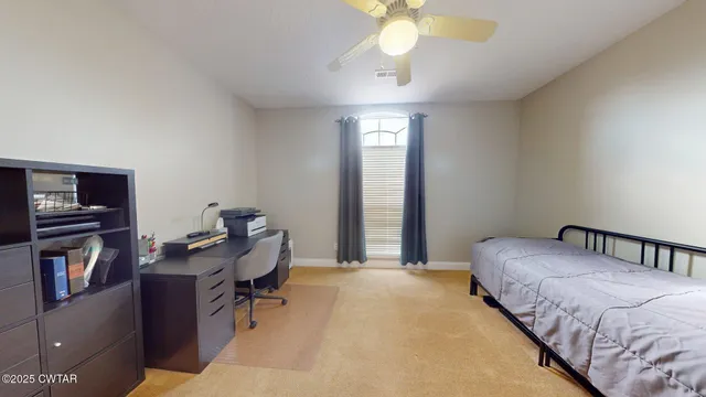 a bedroom with bed and window