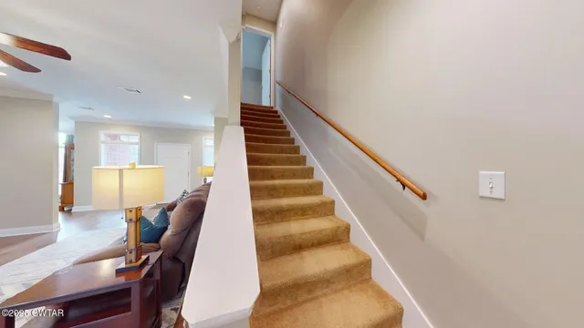 a view of entryway and dining room with wooden floor