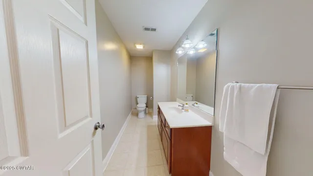 a bathroom with a sink a mirror and a shower