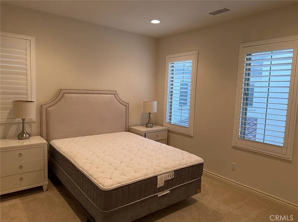 10 Hawkeye Irvine, CA 92602 - Photo 8 of 13 a bedroom with a bed and window