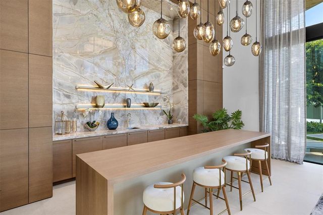 a bathroom with a bathtub sink and mirror